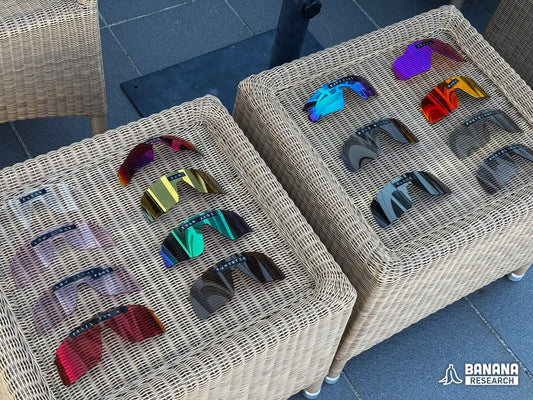 All fifteen Oakley Prizm lens specimens laid out, each with a handwritten tape label, photographed for the Banana Research bench study
