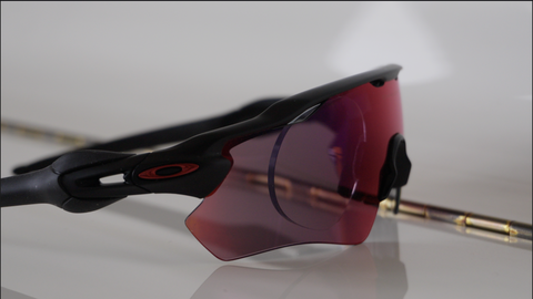 Oakley Radar EV with prescription insert, black frame with red Prizm Road lens, side view