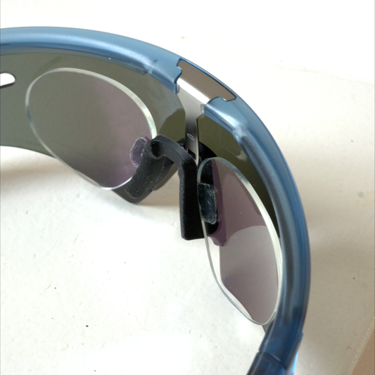 Oakley Sphaera prescription insert seen from inside at an angle, showing the rimless lenses and nosepiece mount