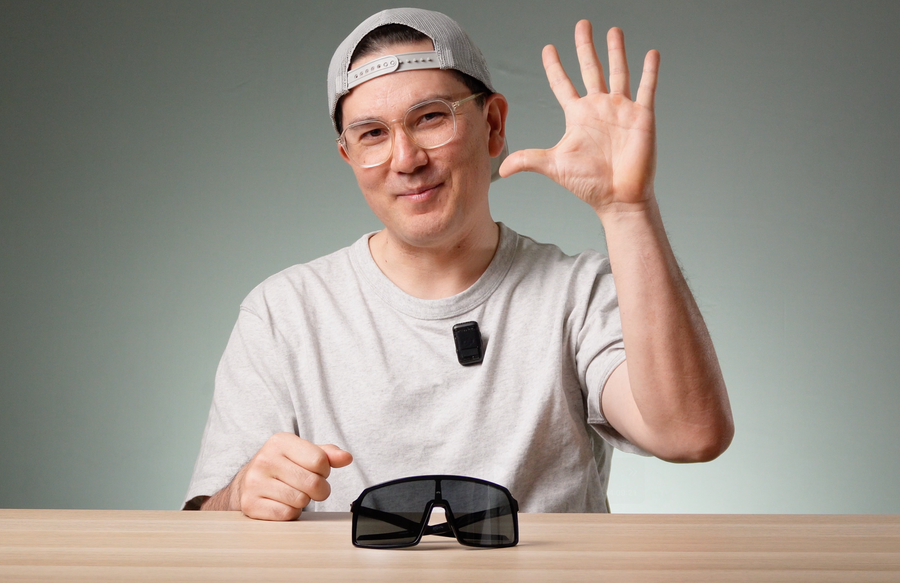 Ken holding a finished prescription lens for an Oakley Sutro