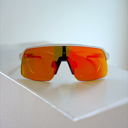 Oakley Sutro Lite S prescription insert front view, white frame with orange-red Prizm mirrored lens