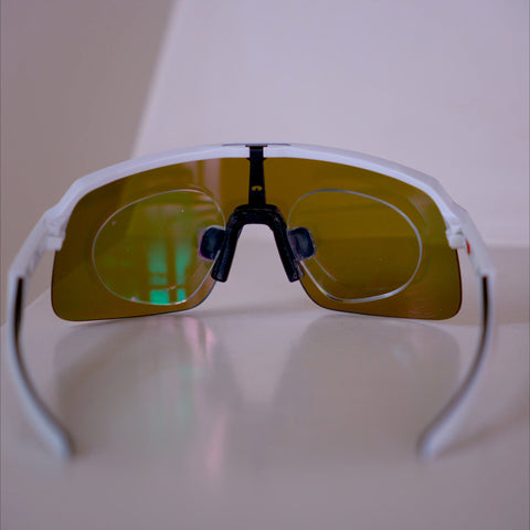Inside rear view of Oakley Sutro Lite S showing prescription insert with both lenses behind gold Prizm shield