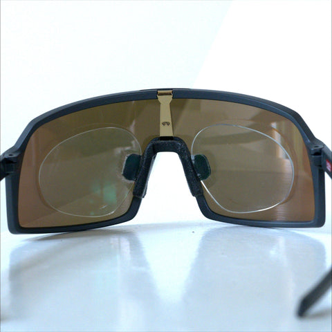 Inside view of Oakley Sutro S showing prescription clip insert mounted behind the shield lens