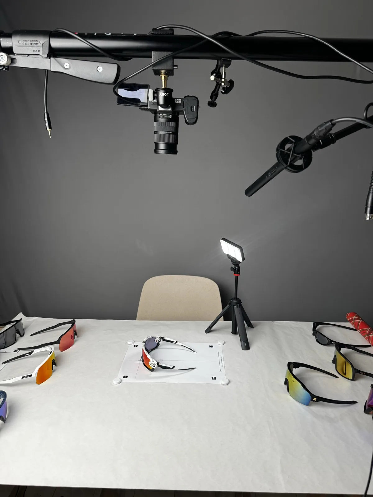 Camera clamped to a horizontal Manfrotto autopole, pointing straight down at the reference mat